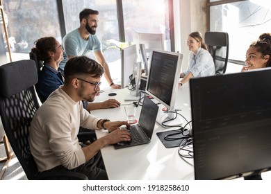 Group of designers programmers working on a new project at the office.	 - Shutterstock ID 1918258610