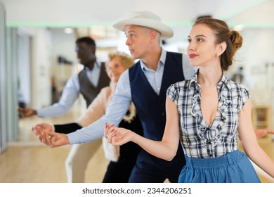 Group of different age dancers preparing swing - Powered by Shutterstock