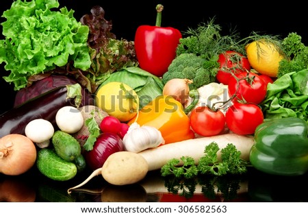 Group of different vegetables on black board