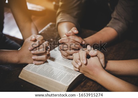 Group of different women praying together, Christians and Bible study concept. 