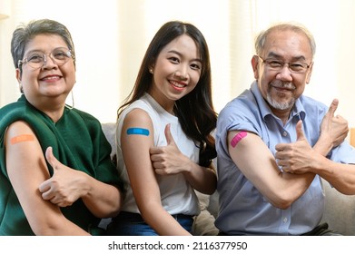 Group Of Diverse Age Asian People Family Senior Showing Bandage Plaster On Arm After Received Covid Vaccination For Prevent Covid-19 Infection. Coronavirus Pandemic Protection Health Care Concept.