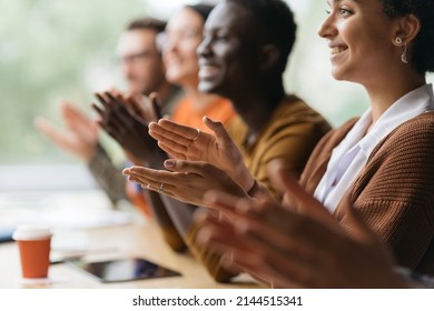 group of diverse business people applauding together. - Shutterstock ID 2144515341