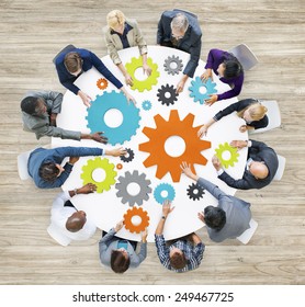 Group of Diverse Business People in a Meeting with Gears