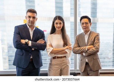 Group Of Diverse Business People Working In The Office With Cityscape Blur Background. Portrait Of Businessmen And Businesswoman Standing In Meeting Room After The Meeting. Business, People, Office