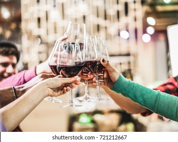 Group Of Diverse Culture Friends Cheering With Red Wine In Trendy Winery Bar - Happy People Drinking And Having Fun Pub Restaurant After Work - Party And Nightlife Concept - Focus On Close Up Hands