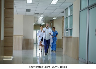 group of diverse doctor team running in hospital corridor during emergency - Powered by Shutterstock