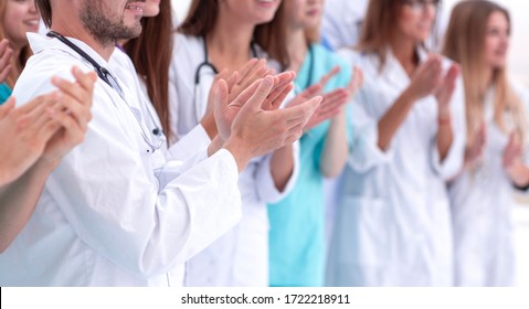 group of diverse doctors applauding their joint success - Powered by Shutterstock