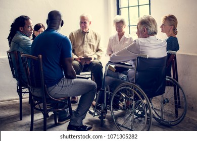 Group of diverse elderly gathering together - Powered by Shutterstock