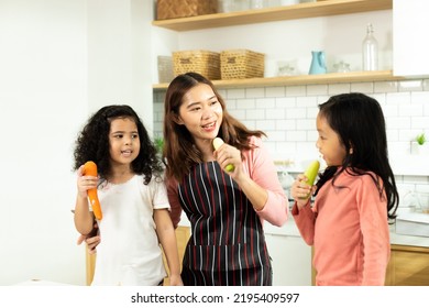 Group Of Diverse Family, Asian And Arab Preschool African Arab Kid Person Make Cake Cooking In Kitchen, Mother Prepare Decoration Pretty With Fun Educate On Snack. Cream Mess All Over Face, Copy Space