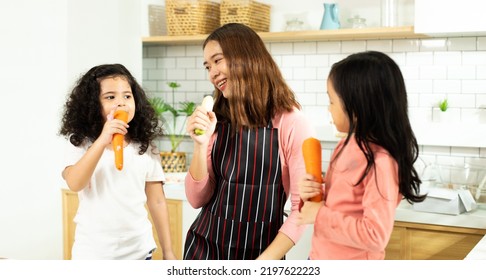 Group Of Diverse Family, Asian And Arab Preschool African Arab Kid Person Make Cake Cooking In Kitchen, Mother Prepare Decoration Pretty With Fun Educate On Snack. Cream Mess All Over Face, Copy Space