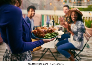 Group of diverse friends having dinner al fresco in urban setting - Powered by Shutterstock