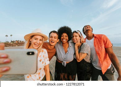 Group Of Diverse Friends Taking A Selfie At The Beach