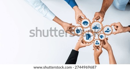 Group of diverse hands collaboratively managing gears with various business icons, symbolizing teamwork and strategy in effective management and leadership. Amity
