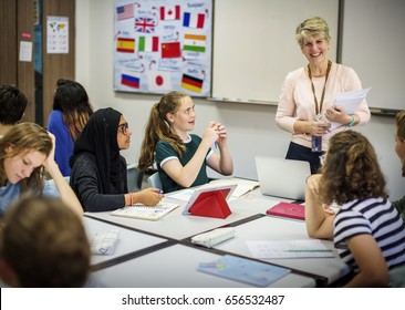 Group Of Diverse High School Students Studying In Class