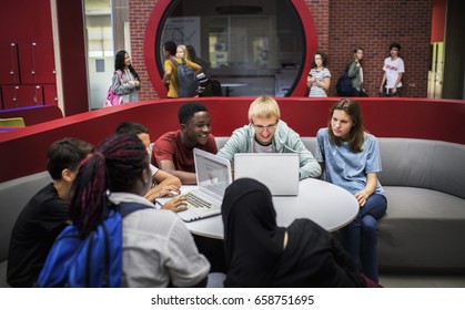 Group Of Diverse High School Students Using Laptop