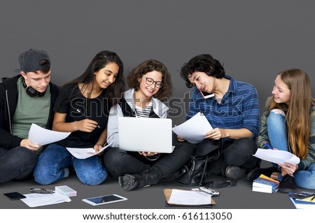 Group of Diverse High School Students Reading Text Book Tutorial