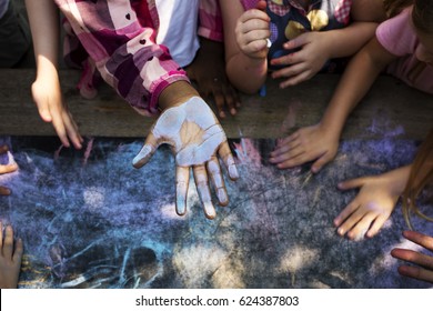 Group Of Diverse Kids Hands With Chalk Paint