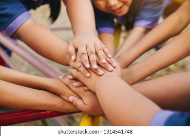 Group Of Diverse Kids Hands Of Together Joining For Teamwork, Community,  Togetherness And Collaboration Concept.