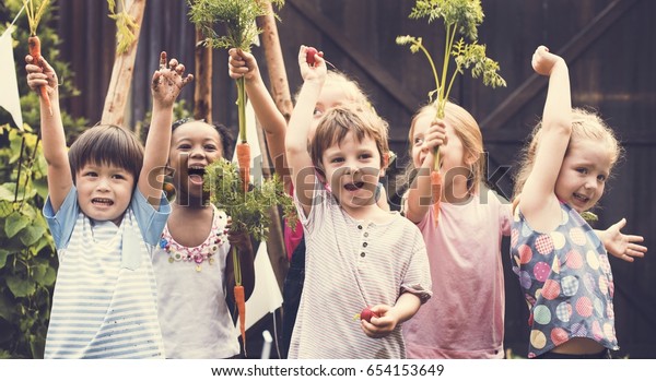 Group of Diverse Kids Learning Environment at
Vegetable Farm