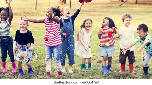 Group of Diverse Kids Playing at the Field Together