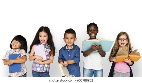 Group Of Diverse Kids Reading Books Together Studio Portrait