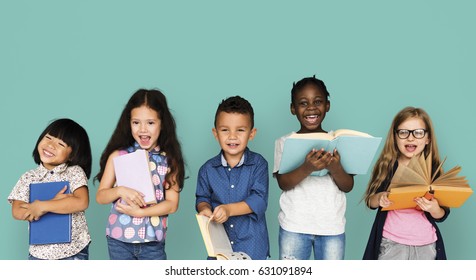 Group Of Diverse Kids Reading Books Together Studio Portrait