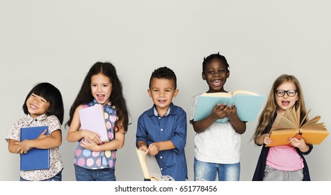 Group Of Diverse Kids Reading Books Together Studio Portrait