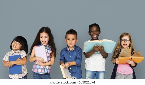 Group of Diverse Kids Reading Books Together Studio Portrait