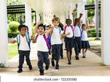 Group of diverse kindergarten students running cheerful after school - Powered by Shutterstock