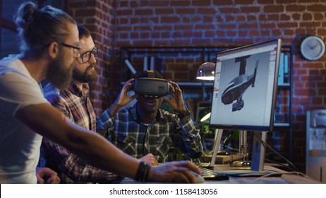 Group Of Diverse Men Using VR Technology And Developing Modern Visual Effects For Videogame And Computing