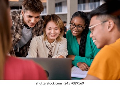 Group of diverse multiethnic smiling young students using laptop studying gathering in classroom. Academics multiracial people classmates working in a project creative inside of university building - Powered by Shutterstock