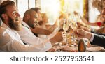 Group of diverse people celebrating at festive dinner party, toasting with champagne. Smiling joyful diverse people celebrating with champagne, festive dinner with friends and celebration party