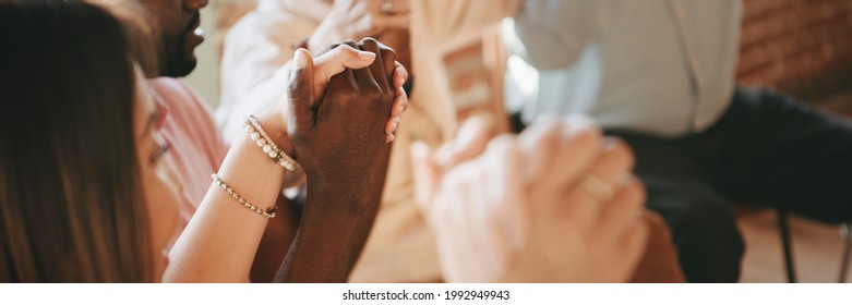 Group Of Diverse People Holding Hands Up In The Air