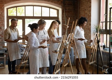 Group Of Diverse People Painting On Easel At Class Lead By Older 60s Teacher, Students Learn To Draw, Involved In Art Activity. Creative Hobby, Artistic Education, Vocation, Revealing Talent Concept