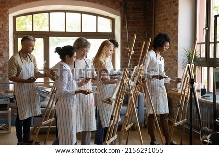 Similar – Image, Stock Photo Elderly woman paints on canvas in a bright studio
