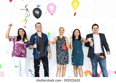 Group Of Diverse People With Party Balloons Confetti