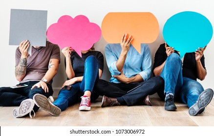Group of diverse people with speech bubbles icons - Shutterstock ID 1073006972