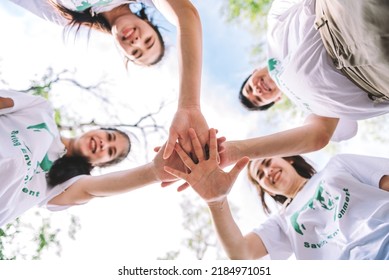 Group Of Diverse People Volunteer Team With Hand Stack To Show Teamwork Spirit Togetherness, Concept Of Success Community Charity People Volunteering On Social To Achievement On World Environment Day.