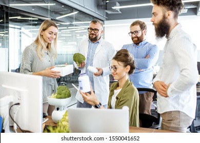 Group Of Diverse People Working On A New Eco Product Or Dietary Supplement In The Office. Branding And Development Of New Trendy Foods Concept