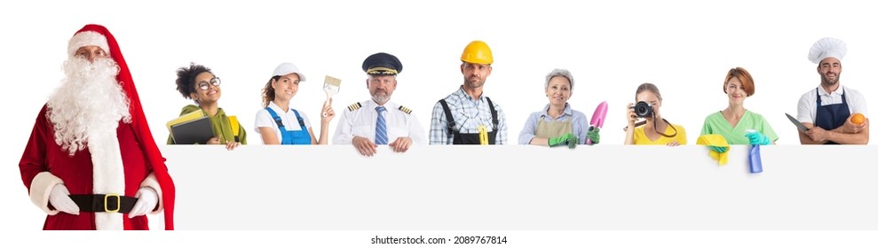 Group Of Diverse Profession Workers And Santa Claus Holding Together Empty Banner. Isolated On White Background, Copy Space For Text