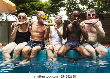 Group Of Diverse Senior Adults Eating Watermelon Together