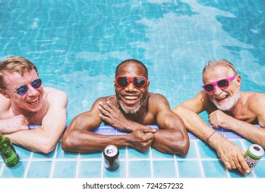 Group Of Diverse Senior Men Enjoying The Pool Together