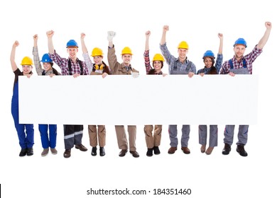 Group Of Diverse Skilled Motivated Workmen And Women Standing In A Line Cheering Celebrating A Success Holding A Blank White Banner With Copyspace For Your Text On A White Background