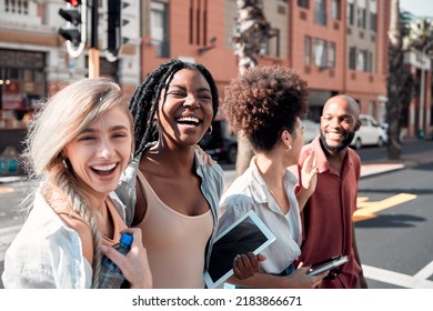 A Group Of Diverse Students Having Fun Outdoors In The City On A Sunny Summer Day. Portrait Of Young People Or Friends Laughing And Smiling Together In An Urban Town While Walking To Campus