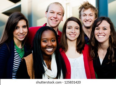 Group of Diverse students outside smiling