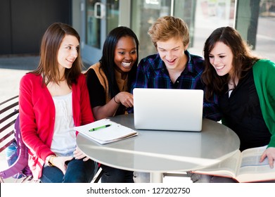 Group Of Diverse Students Outside Studying