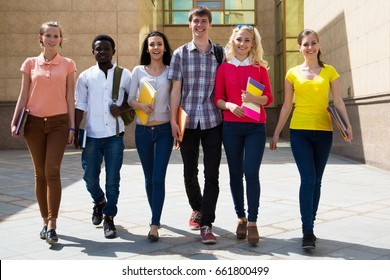 Group Of Diverse Students Outside Walking Together