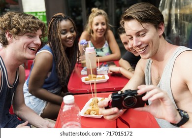 Group Of Diverse Tourist With Camera At Bangkok Thailand Walking Street Food Stall