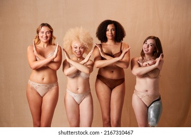 Group Of Diverse Women Body Positive Friends One With Prosthetic Limb In Underwear With Crossed Arms