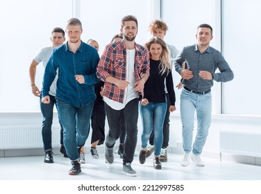 group of diverse young people running forward - Powered by Shutterstock